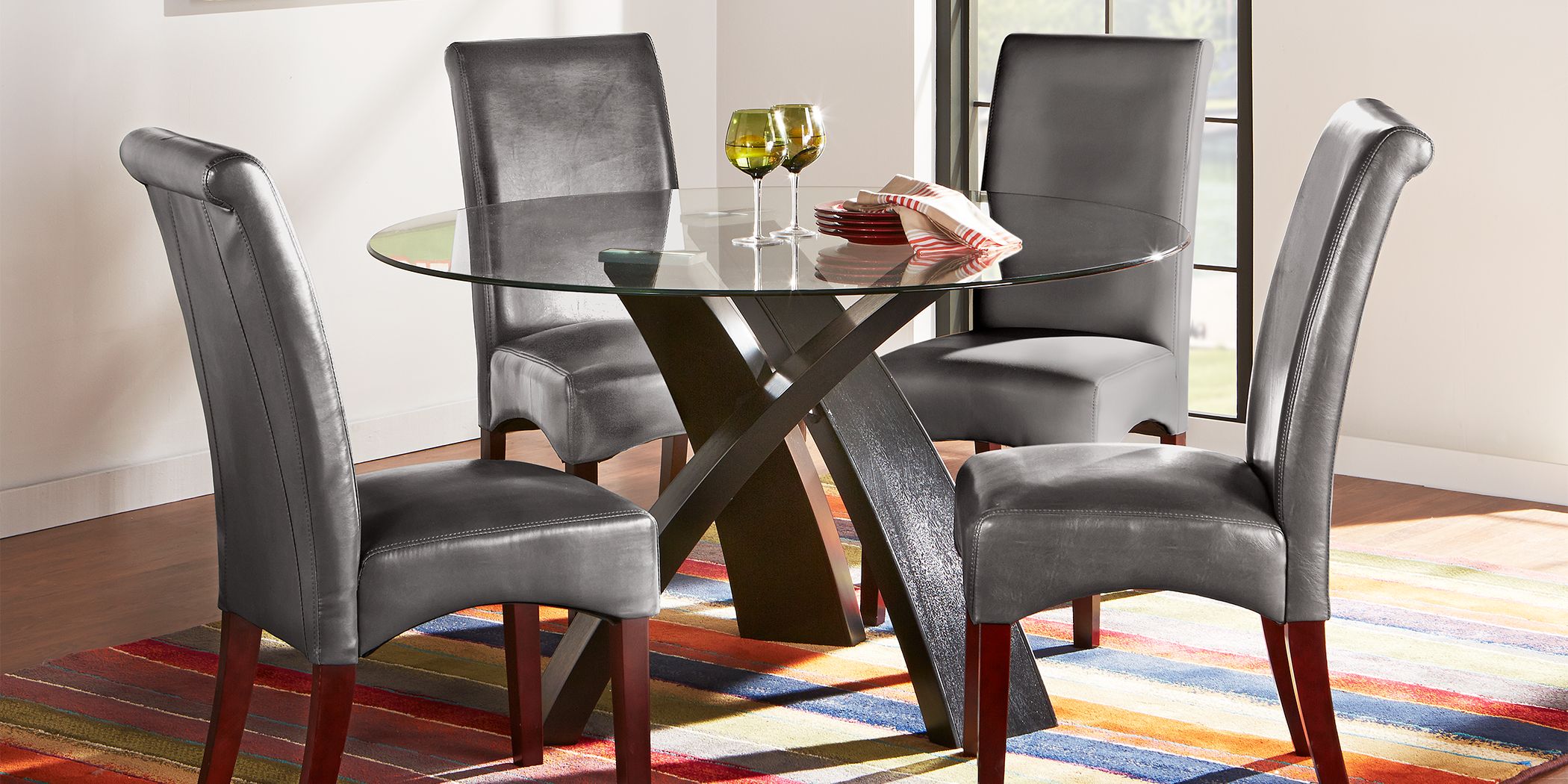 Del Mar Ebony Pc Round Dining Set with Charcoal Chairs Rooms To Go - Main Image